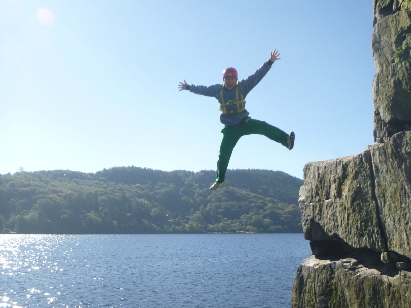 An adult leaping from elephant rock at Llyn Gwynant